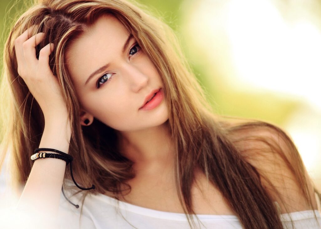 woman with beautiful, long hair and tape in hair extensions