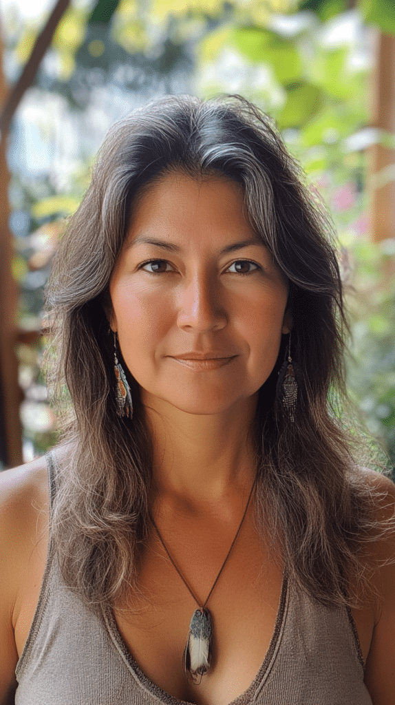 Woman with medium-length layered hair and extra volume at the crown