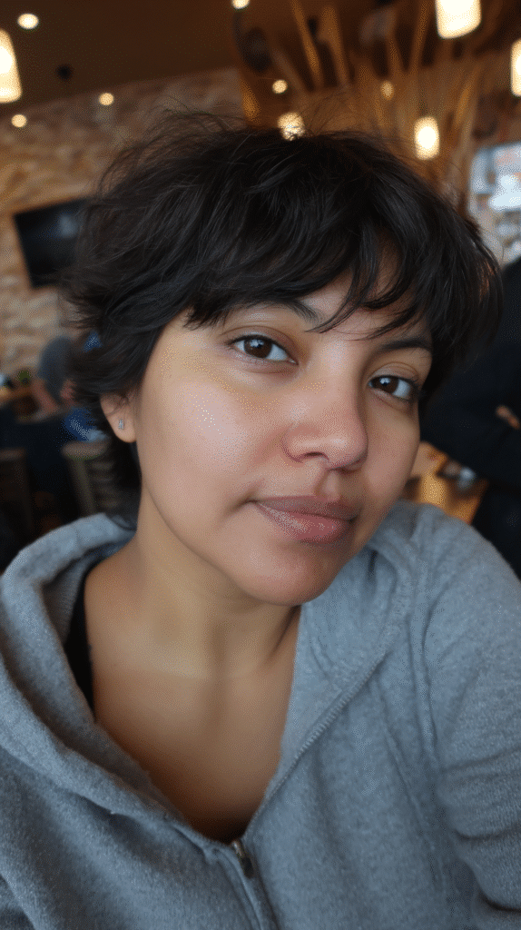 Elegant short shag hairstyle with deep side-swept bangs, adding sophistication and movement.