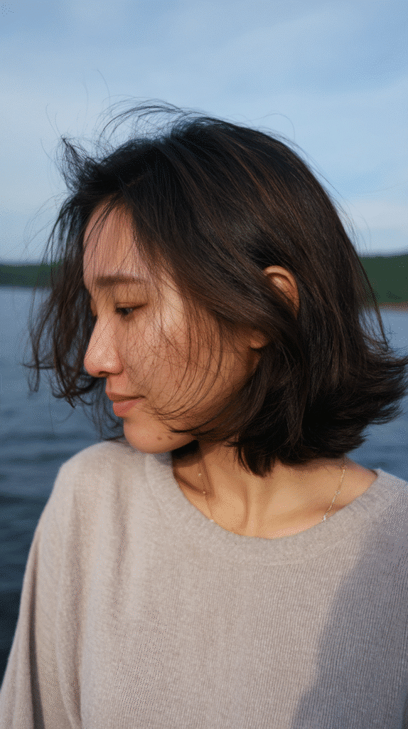 Romantic short shag haircut with feathered ends, offering a light, breezy, and soft finish.