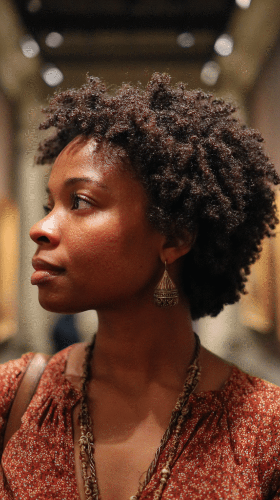 Chin-length tapered afro cut for compact shape and lift
