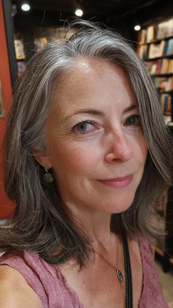 Dark hair with gray balayage for a smooth salt and pepper transition.