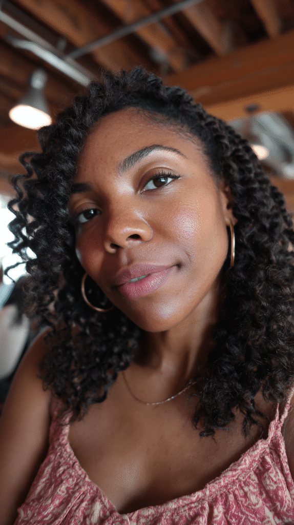 Shoulder-length curly hair with a side-swept fringe