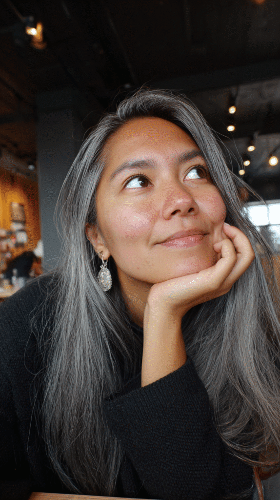 A soft grey melt seamlessly blended into natural black hair for a fluid ombré.