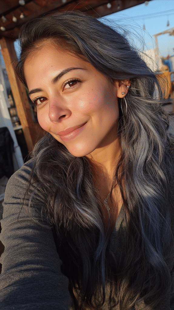 Tousled dark waves colored with a dreamy blend of silver and blue tones.