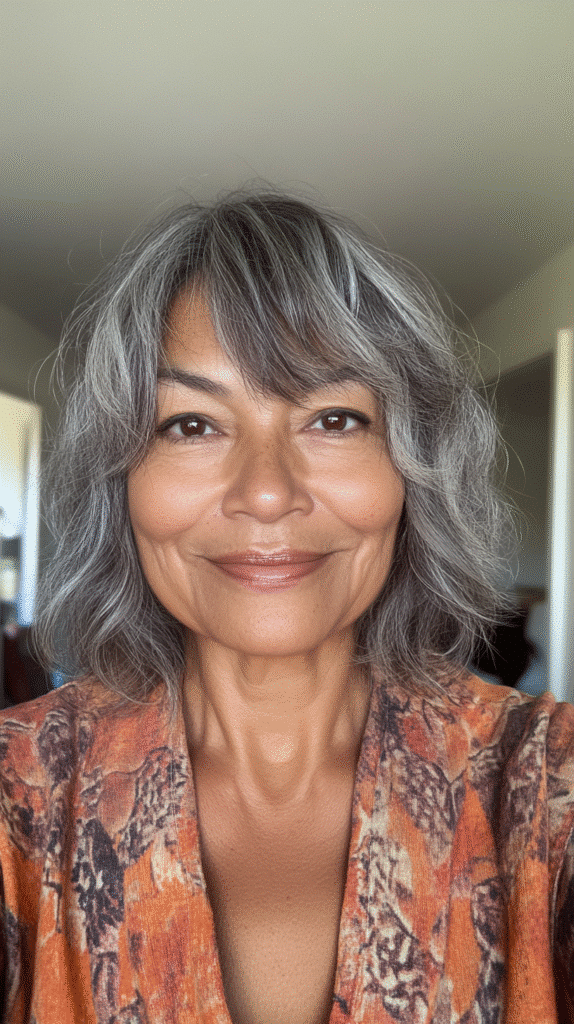Woman with a shaggy bob featuring choppy layers and bangs for added movement.