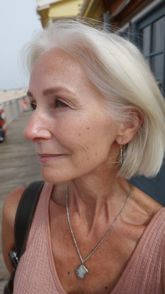 Woman with a stacked bob showcasing short layers at the back for enhanced crown volume.
