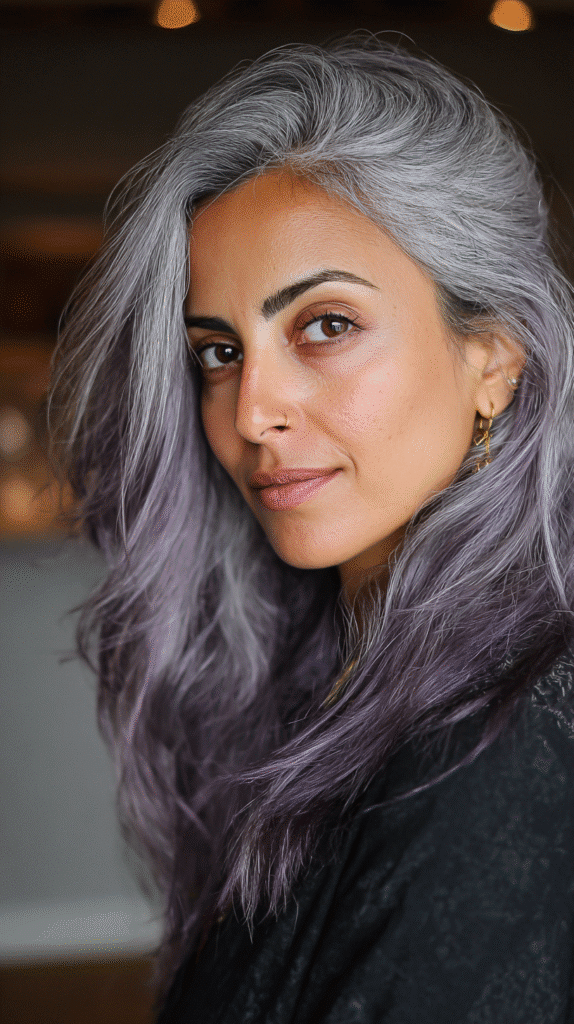 Frosted grey strands infused with vibrant violet lowlights for a fashionable, edgy style.