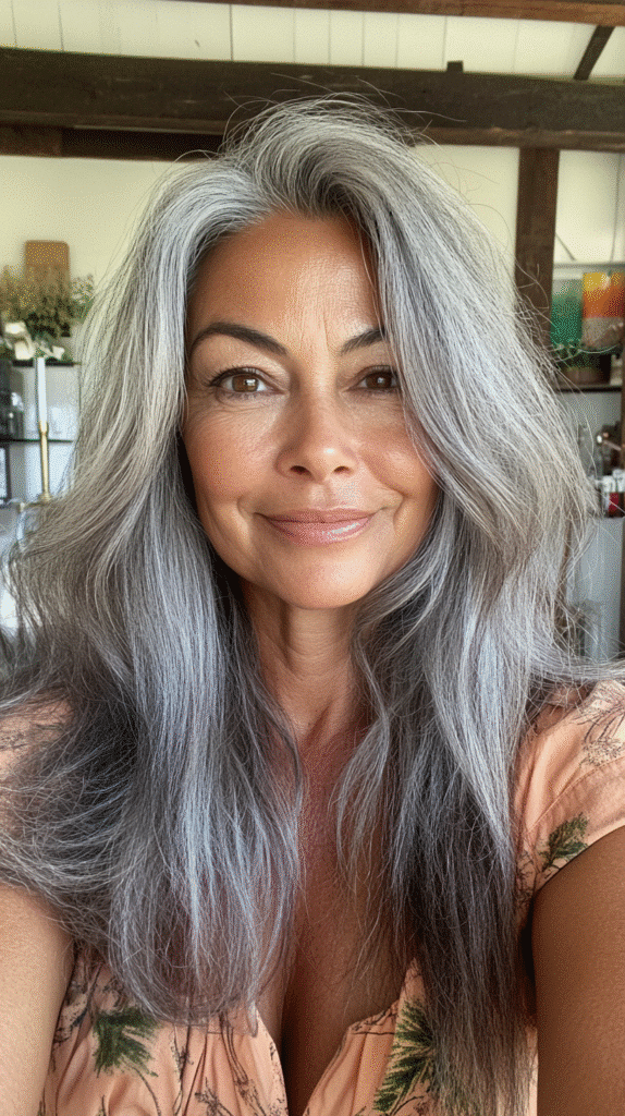 Deep gunmetal grey hair layered with espresso lowlights for a bold and sultry effect.